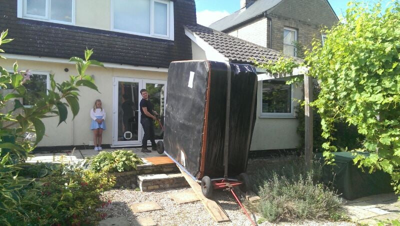 Man moving a hot tub