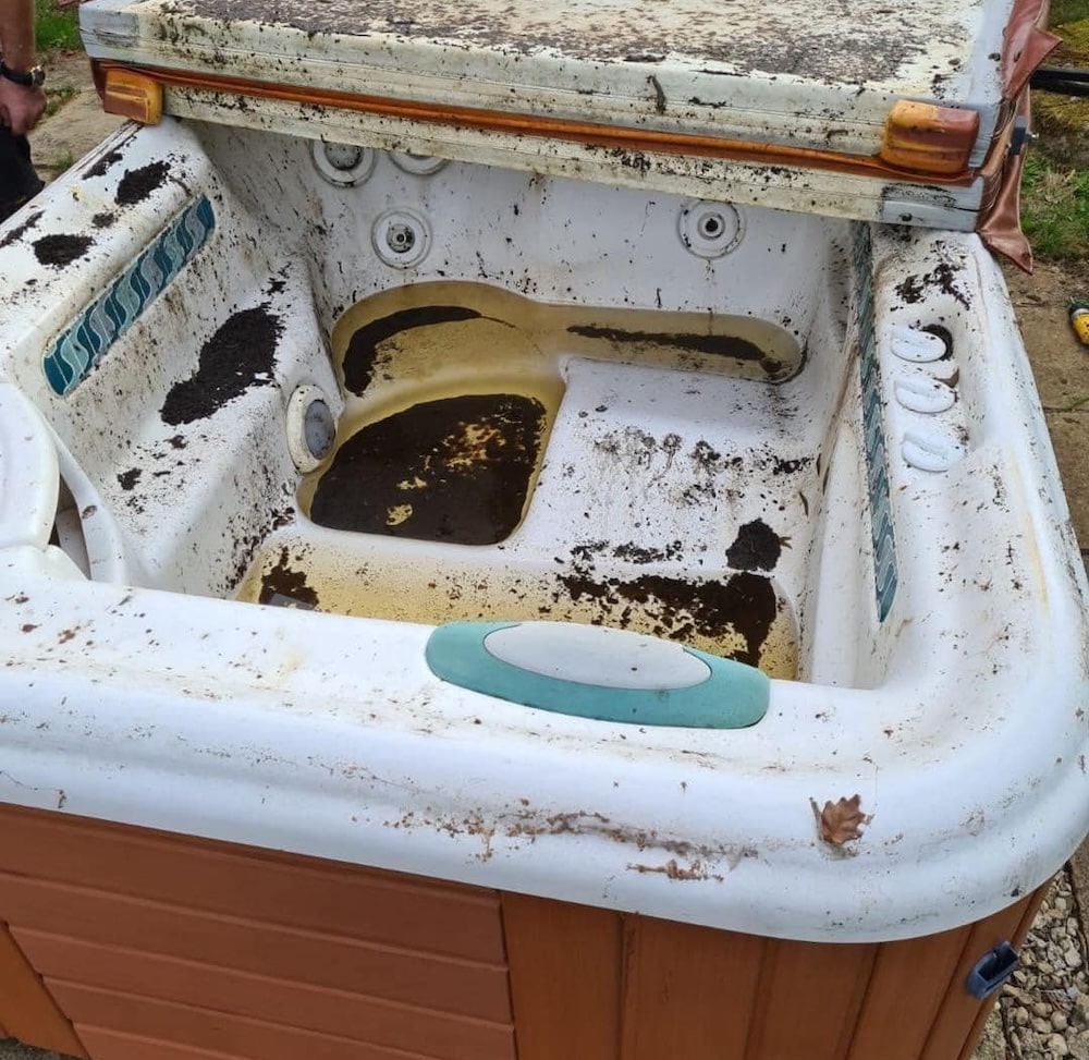 Dirty old hot tub for disposal
